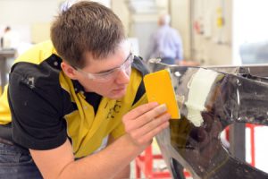 Image of student enrolled in the Collision Repair and Refinishing Technology associate’s degree program.
